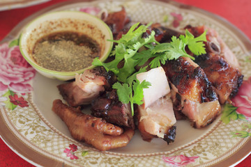Roast (grilled) chicken with steamed glutinous rice isolated on white background (selective focus)
