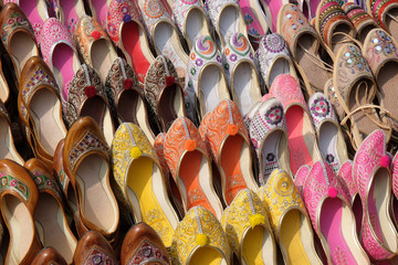 Display of traditional shoes at the street market in Jaipur. Jaipur is the capital and the biggest...