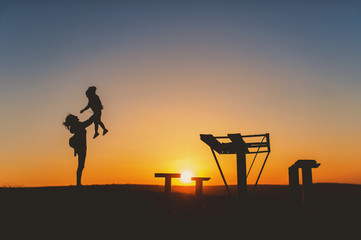 Silhouette of mother and child