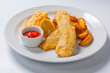 fish and chips with salad and sauce
