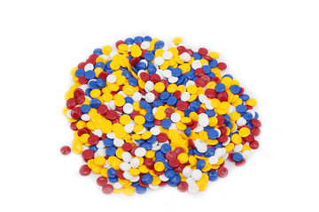 Colorful plastic polymer granules on white