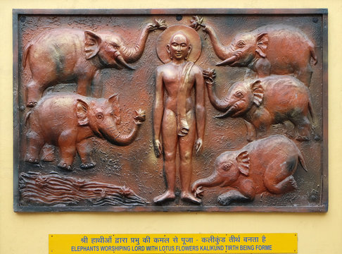 Elephants worshiping lord with lotus flowers Kalikund tirth being forme, Street relief on the wall of Jain Temple in Kolkata