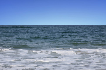Sky, ocean and surf.