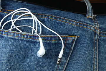 Blue denim jeans in dark color in the scene present the old denim look at the back pocket part with...
