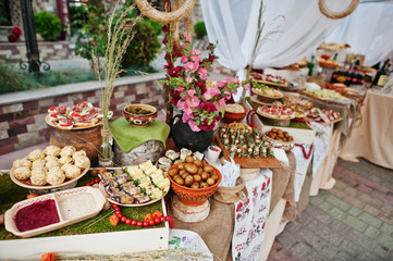 Traditional ukrainian food at wedding reception outdoor.