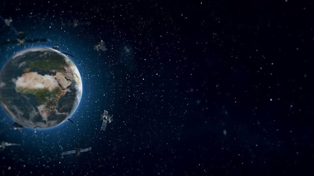 Looped Animation of Earth Satellites Side View. The looped video with Earth satellites moving in orbit around the planet. 