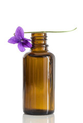 Raw materials for essential oils, organic cosmetics. Flowers with glasss bottle