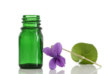 Raw materials for essential oils, organic cosmetics. Flowers with glasss bottle