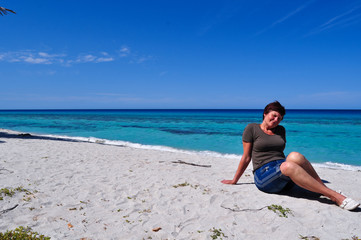 Fototapeta na wymiar Adult woman on the beach