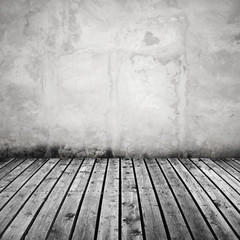 White concrete wall and dark gray wooden floor