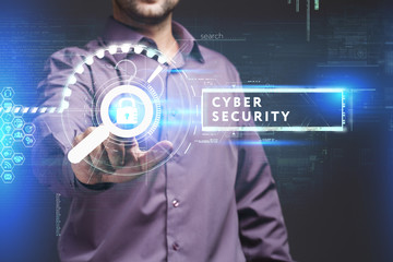 Business, Technology, Internet and network concept. Young businessman working on a virtual screen of the future and sees the inscription: Cyber security