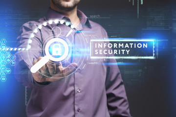 Business, Technology, Internet and network concept. Young businessman working on a virtual screen of the future and sees the inscription: Information security