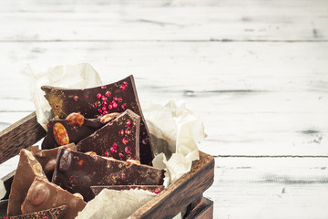 Variety of chocolate bars in wooden box