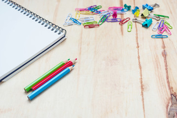 Office supplies on wood desk top shot directly above
