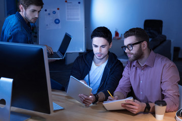 Handsome hard working programmer working in team