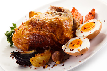 Roast chicken meat with potatoes and boiled egg