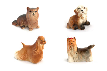 Collage of porcelain dogs isolated on white background