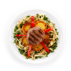 Roast steak with potatoes and vegetables