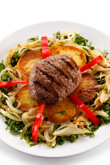 Roast steak with potatoes and vegetables