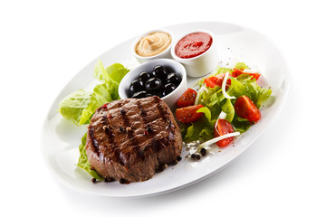 Roast steak on white plate