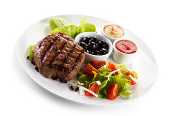 Roast steak on white plate
