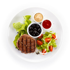 Roast steak on white plate