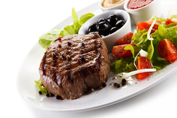 Roast steak on white plate