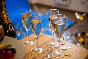 Close up photo of glasses with champagne.