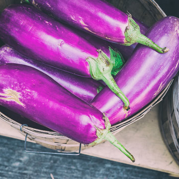 Violet eggplants at the market with retro filter