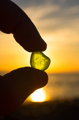 sea smoothed green glass in hand