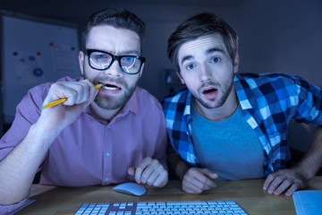 Nice handsome men sitting with his friends