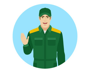 Worker greeting someone with his hand raised up