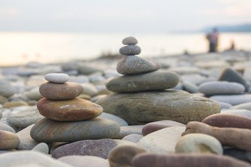 Fototapeta na wymiar stack of zen stones on beach