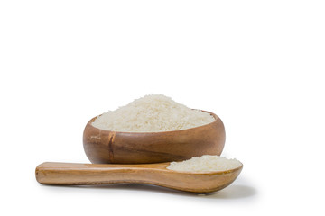 white rice  heap in  wooden cup and spoon isolated on white background, File contains a clipping path.