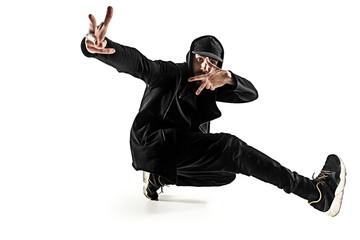 The silhouette of one hip hop male break dancer dancing on white background