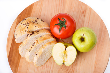 white bread with beans, tomato, Apple on a wooden tray