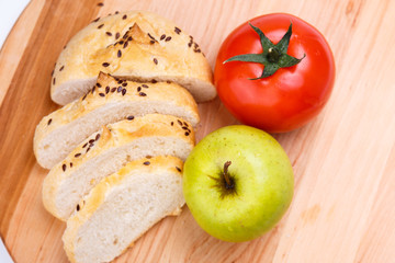 Naklejka na ściany i meble white bread with beans, tomato, Apple on a wooden tray