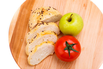white bread with beans, tomato, Apple on a wooden tray