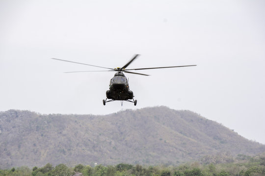 Helicopter in flight. Fly over the mountain and  sky