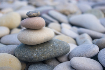 Fototapeta na wymiar stack of zen stones on beach