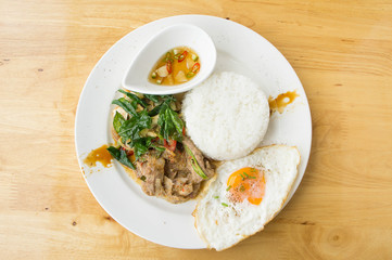 Grilled pork basil with Fried egg , stir basil with crispy pork , Kind of favarite Traditional Thai foods