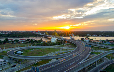 Fototapeta na wymiar Nonthaburi bridge in Bangkok Thailand road for transportation and sunset