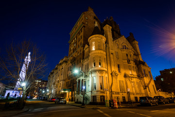 Fototapeta na wymiar Historic buildings on Madison Street at night, in Mount Vernon, Baltimore, Maryland.