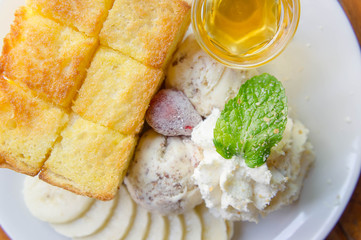 ice cream honey toast and whipped cream on the table