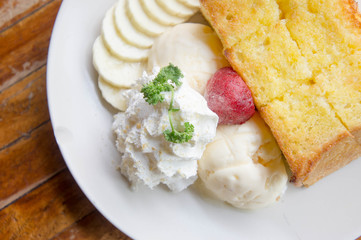 ice cream honey toast and whipped cream on the table