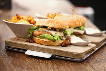 Two delicious wurst burgers served with french fries