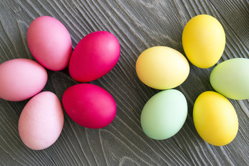 Colored painted eggs on a gray background. Easter celebrating