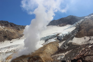 Fototapeta na wymiar White fumaroles of the volcano Mutnovsky Kamchatka