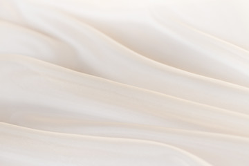Obraz na płótnie Canvas Wavy beige organza close-up