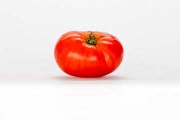 ripe garden tomato isolated